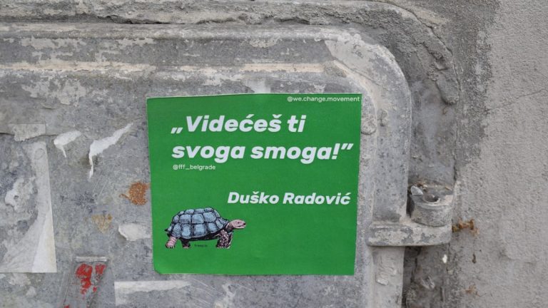green and white wall mounted signage